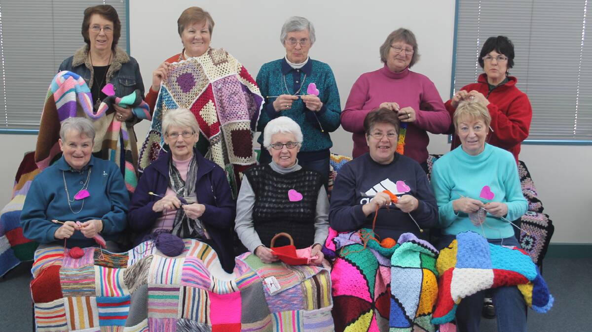  KNIT IN: A committed group of ladies gather to work on a voluntary project for Wrap With Love including (back, from left) Marj Boxsell, Helen Morgan, Joyce Crain, Irene Minnett and Margaret Elmes (front) Mavis Alexander, Lyn Lyster, Jenny Cash, Dorothy Billsborrow and Sue Richardson.