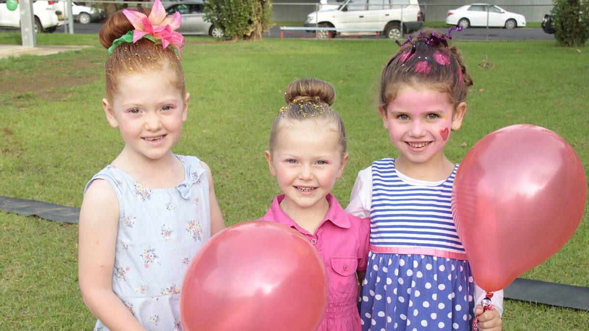 ENJOYING THE FETE: Sisters Charlotte and Matilda Campbell are pictured with friend Amarli Kelleher at the Sacred Heart Fete last Friday. 
