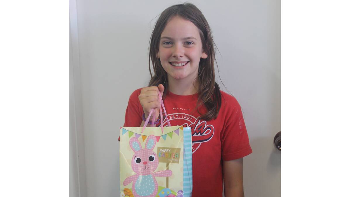  CORRECT: Eight year old Olivia Scott was one of two winners that guessed the correct amount in Cootamundra Herald Easter Egg guessing competition. She is pictured here with her share of the bounty. Caitlyn Fitzgerald also guessed the exact amount of 272 eggs. Money raised from the guessing competition will go to Riding for the Disabled. 
