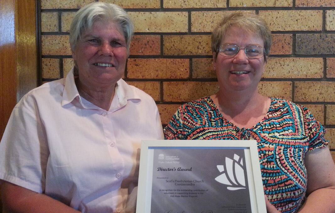 COMMITTED: Scots Presbyterian Church has received a DEC Director’s Award thanks to the hard work of Kids Hope Aus volunteer mentors. Pictured with the award are program coordinators Jan Mitchell and Sue Masters.