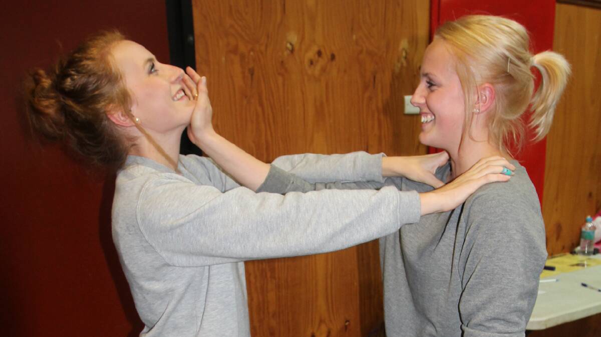 GOT IT COVERED: Abbey Watson (left) and Kristen Leak take part in the last self defence class, held in June this year. 