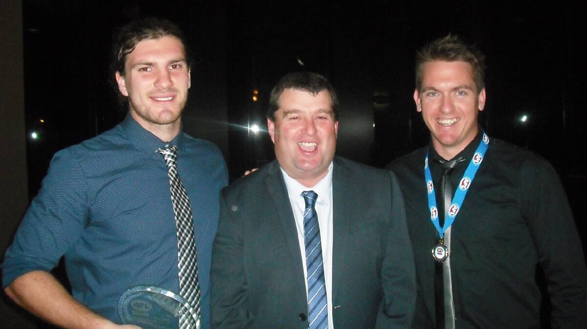  CHEERING: (From left) Sandy Maskell Knight, Blues president Todd Basham and Luke Webb celebrate in Canberra on Sunday after Webb was awarded best and fairest of AFL Canberra division three and Maskell Knight won the league’s goal kicking award. Photo: Contributed