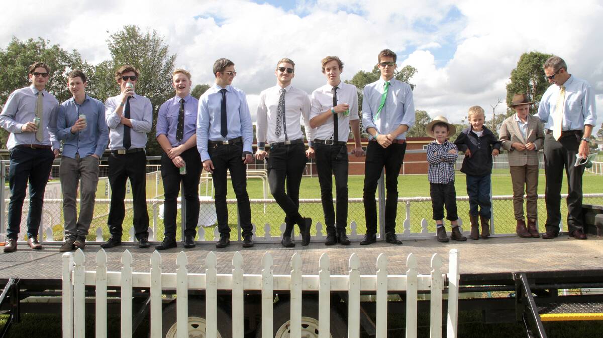 FOR THE BLOKES: The men line up in the Fashions on the Field competition during Saturday’s successful Cootamundra Picnic Races meeting.
Photo: Kelly Manwaring 

