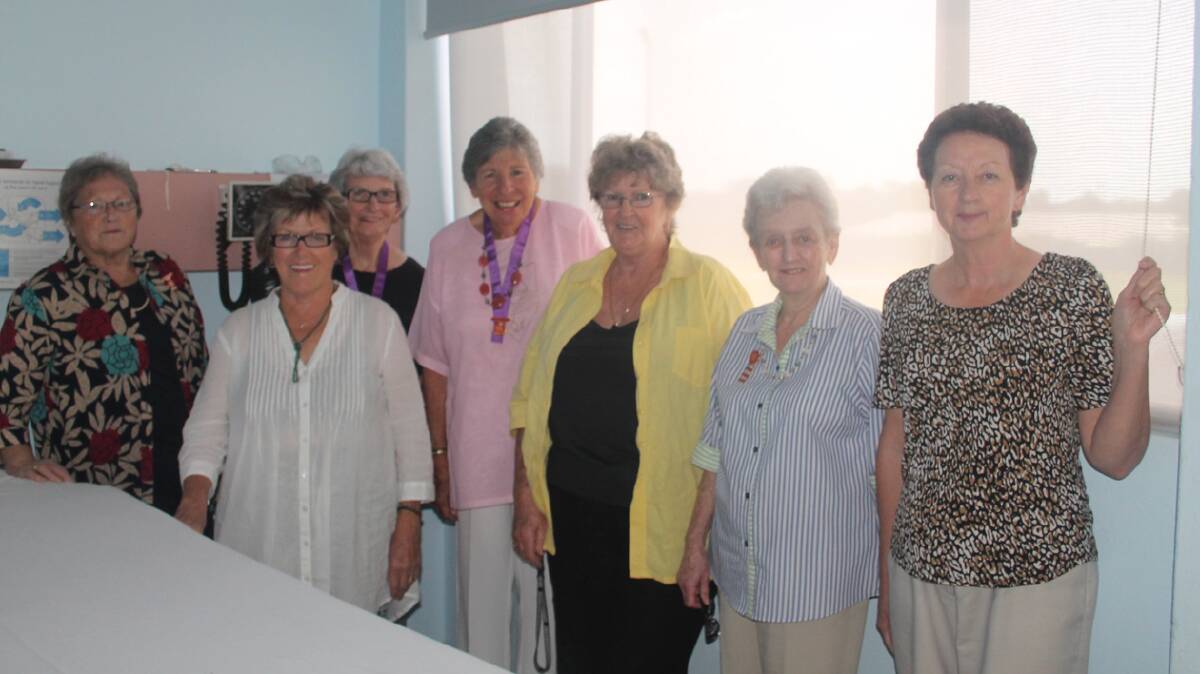  NEW LOOK: The Cootamundra Hospital’s upstairs verandah area has been given a new look with the purchase and installation of new blinds by the Cootamundra Hospital Auxiliary (pictured from left) with blinds similar to that upstairs (from left) Helen Eccleston, Denise Holland, Nola Hamilton, Jenny McClintock, Lucille Arley, Chris Kirkland and Joan Collins.