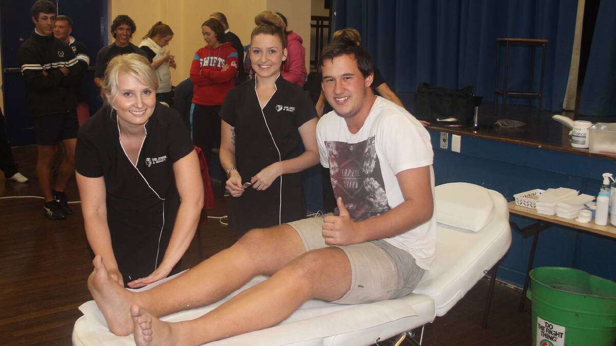  ALL FOR A CAUSE: pictured (right) is Cootamundra High School student Jarrod Chapman with Alyssa Forsyth (left) and Emily Fitzgerald from Hair Design at the school hall on Friday. Jarrod was one of a number of students who got waxed and shaved as part of the World’s Greatest Shave. The school also held a mufti day in which students were required to give a gold coin donation to the cause.
At the time of writing, the school had raised more than $500.