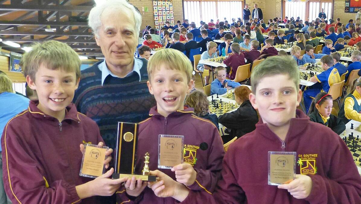 BRONZED BRAINIACS: EA Southee Public school took out third place at the Riverina One-Day Chess Tournament, the best result for our region so far. Pictured (from left) is team captain Jacob Maher, NSW junior chess league primary school coordinator Richard Gastineau-Hills, Elijah Holmes and Michael Perry.