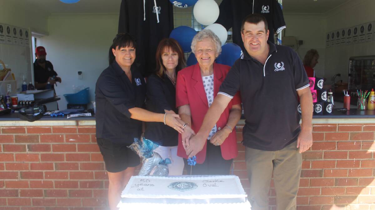 MARKING HALF A CENTURY: Cutting the cake to mark 50 years of Clarke Oval are (from left) Blues committee members Lee Loiterton and Shelly Johnston, Mrs Norma Clarke on behalf of her late husband Jim and Blues president Todd Basham. 