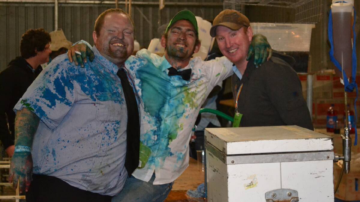 FULL OF COLOUR: pictured (from left) are Ben Purtell, Nick Carr and Steve Armstrong at the Cootamundra B and S ball which was held at the showgrounds on Saturday. 
Photo: Contributed