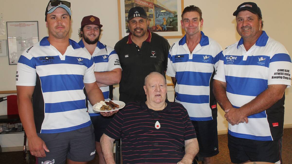  COMPANY OF A LEGEND: Bulldogs players and committee members enjoyed chatting with former Bulldogs president John Sheedy (seated) while at the Retirement Village last week to man the barbecue for residents. Pictured (standing from left) are Luke Berkrey, Andrew Bucknell, Mark Elia, Ashley Cooper and Wayne Berkrey.  