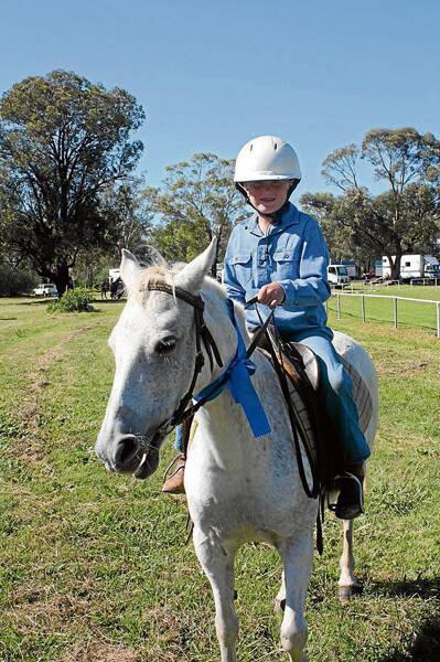 HAVING FUN: eight-year-old Cootamundra boy Isaac Tregear took part in the Stockinbingal Village Fair gymkhana on Sunday. Fair organisers say the horse events are becoming more popular every year.  