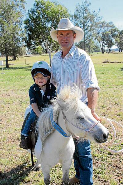 BORN IN THE SADDLE: with parents Grant and Leina Richardson involved in horses, it is no wonder Kody Richardson looks at home on his pony, Motza. Kody and Grant are pictured during the popular junior events associated with the Stockinbingal Village Fair gymkhana. 
