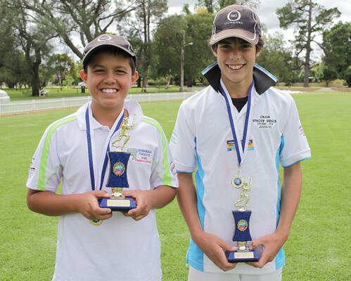  PROUD: Ryan Connell (left) and Jason Cronin proudly show off the trophies they received at the recent junior cricket presentations. Both Ryan and Jason were named the Smith Shield 14’s Rep Players of the Year.