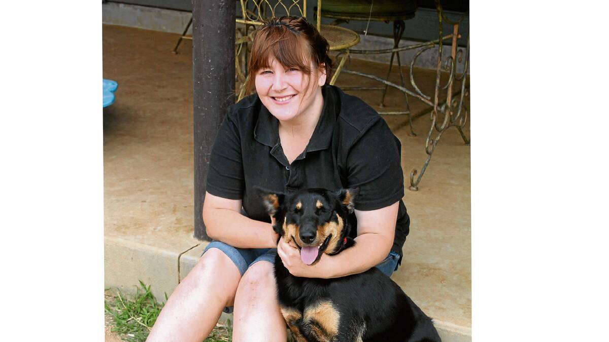 A DOG’S LIFE: Hannah Orr is pictured with one of her four rescue dogs ‘Talk’, a working dog who did not quite live up to life in the paddock but now has a new home with Hannah and her mum. Hannah works to re-home dogs from the Cootamundra Pound across the region. 