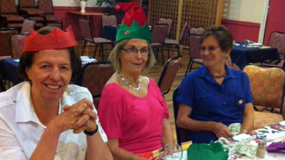 CHRISTMAS CHEER: pictured (from left) are Margot Gill, Loo Manning and Kathy Rolfe.