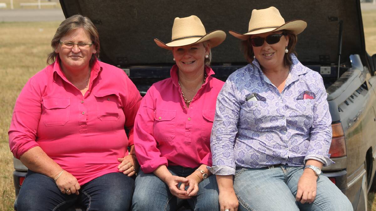 SPECTATING: Enthralled in the Stockman’s Challenge at the Cootamundra Show on Saturday were (from left) Colina Meadows, Jenny Coleman and Penny Fisher.