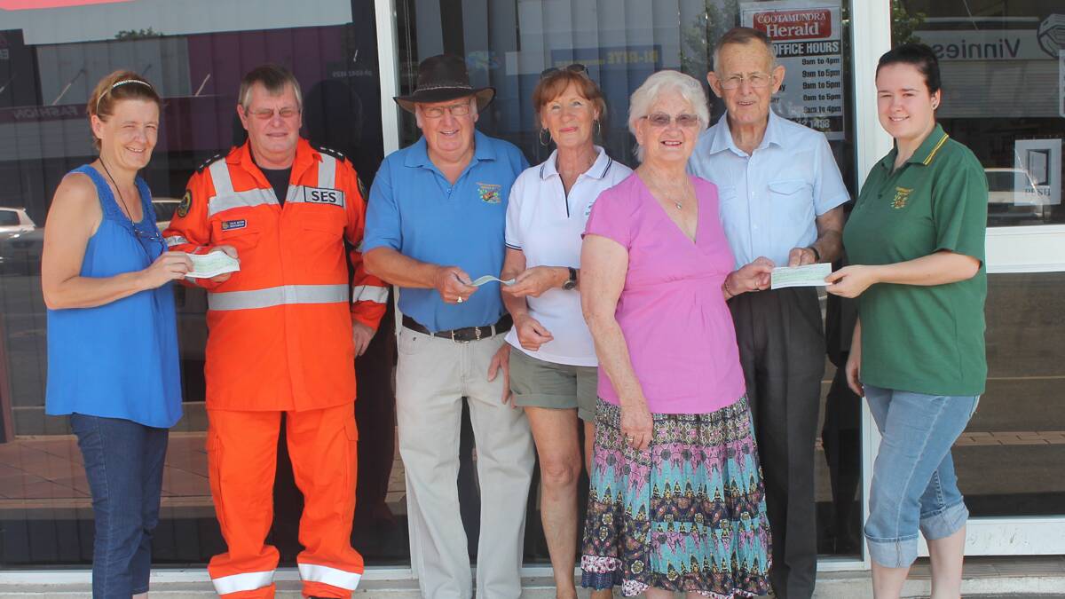  WITH THANKS: Pictured during the handover of funds from the Cootamundra Wattle Country Music Club which hosts the monthly markets in town to local organisations are (from left) Country Music member Tracey Gould, SES deputy controller Colin Wilson, Country Music president Ron Owen, Snowy Hydro volunteer Carol Smith, Retirement Village Auxiliary secretary Marjorie Hart and member Don Hart and Country Music secretary Katie Gould. 