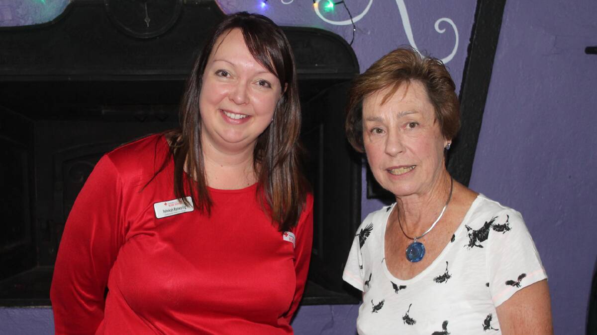 RED CROSS CHRISTMAS: pictured (left) is Red Cross Community Relations Officer Rebekah Manwaring  and Cootamundra Volunteer Nancye Hicks at E’Claire’s coffee shop on Wednesday. Based in Wagga, Rebekah was in Cootamundra to thank the local volunteers for all their hard work throughout the year.