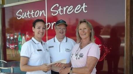  WITH THANKS: local Snowy Hydro SouthCare volunteers Carol Smith (right) and Jeffrey Watts Jnr (centre) pass a cheque worth $1500 from proceeds from their secondhand book store to Snowy Hydro SouthCare finance and volunteer manager Bronwen Bitmead.