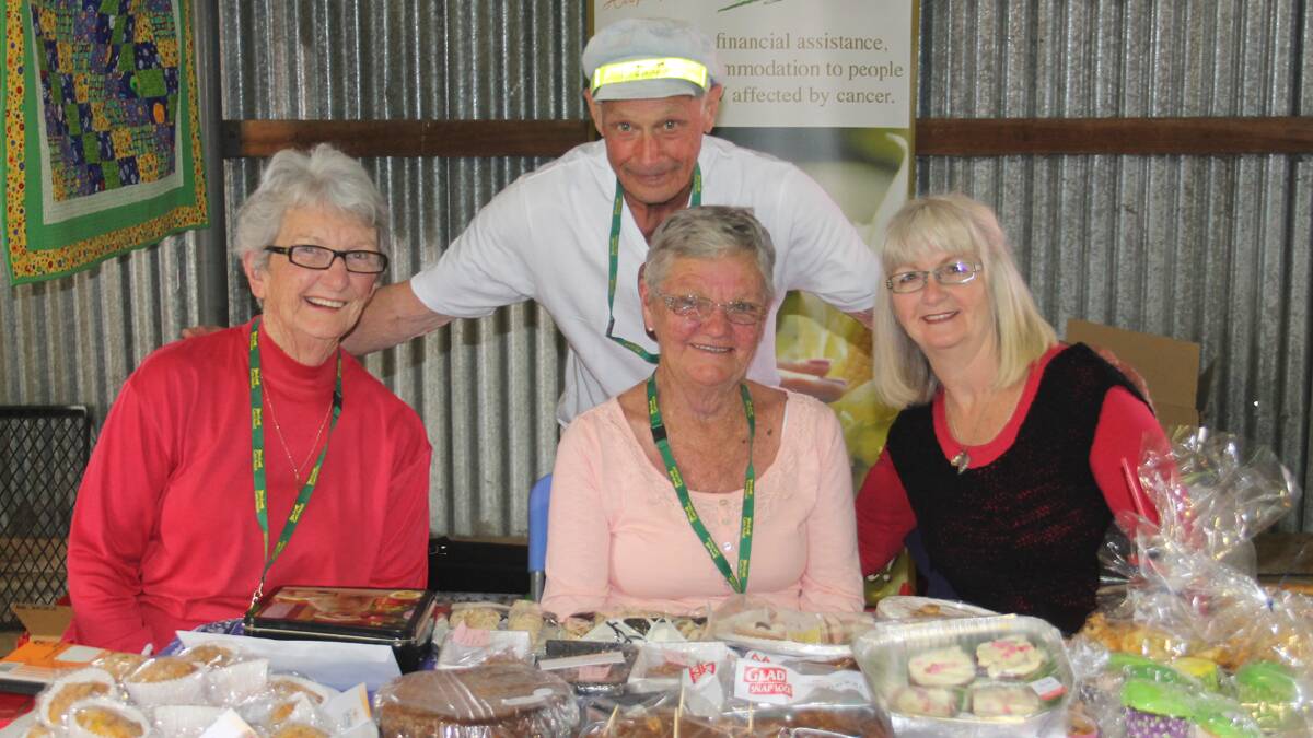  YUM: Cootamundra Can Assist members (from left) Nola Hamilton, Joan McVicar, Maryanne Izzard and Norm McVicar are pictured with some of their delicious items for sale at the Cootamundra Show on the weekend.