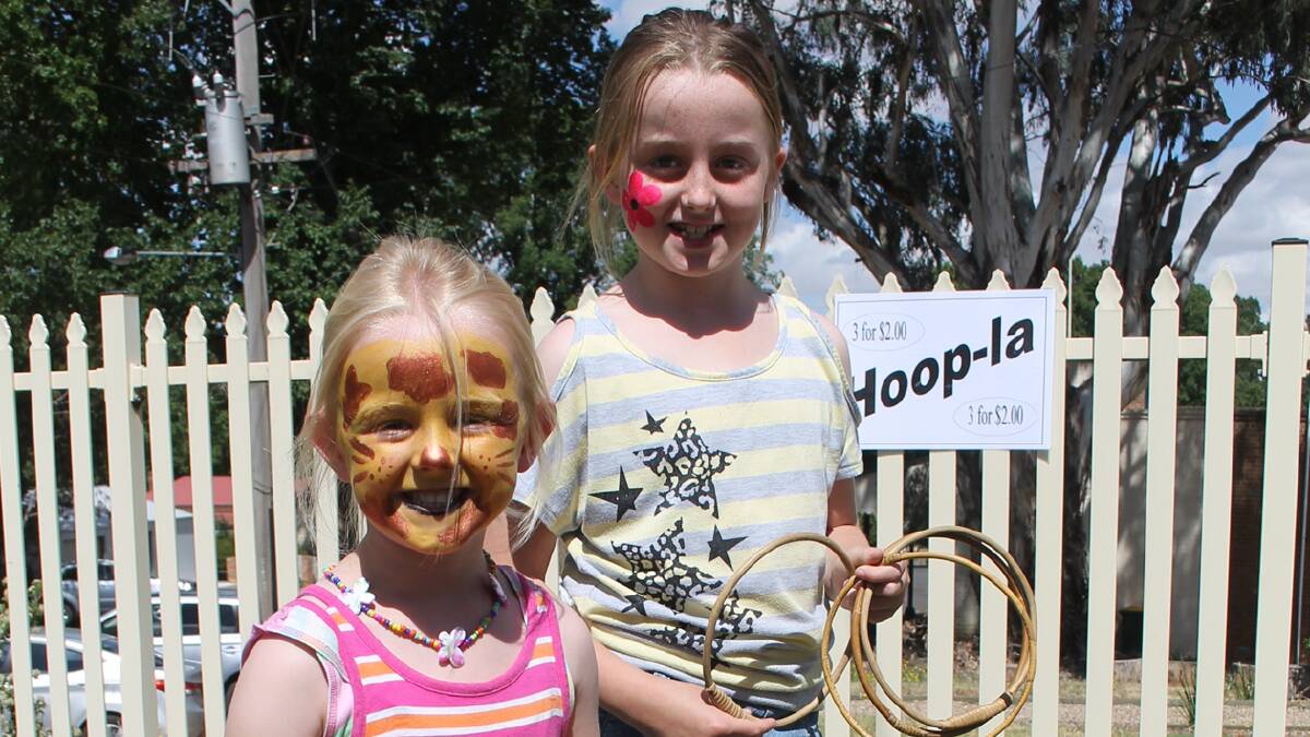  Josie and Grace Hoey are pictured here playing Hoopla at the Fair. The Hoopla stand was in the hands of Suzie McDonald who was doing a sterling job entertaining the children present and providing fun prizes.