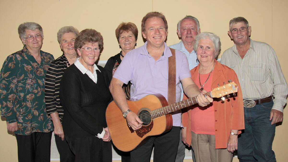 TERRIFIC EVENING: Pictured with entertainer Rodney Vincent are Can Assist members Jan Randall, Mavis Bracken, Alma Smart, Neil Murray, Bob Randall, Jill Dodwell and Marie Murray.   Photo: Kelly Manwaring 