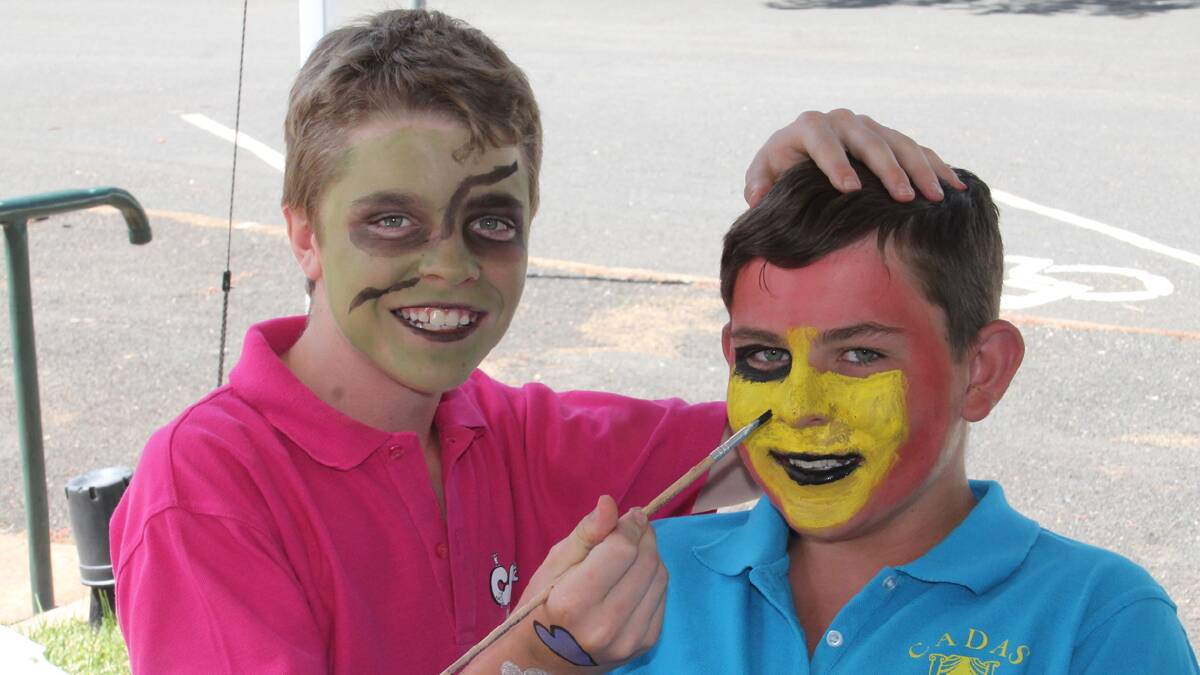  BRIGHT: Taking the opportunity to have their faces painted at the Wallendbeen Red Cross Christmas Fair on Saturday were Campbell Cooper-Duck and Jaycob Madden-Belle.