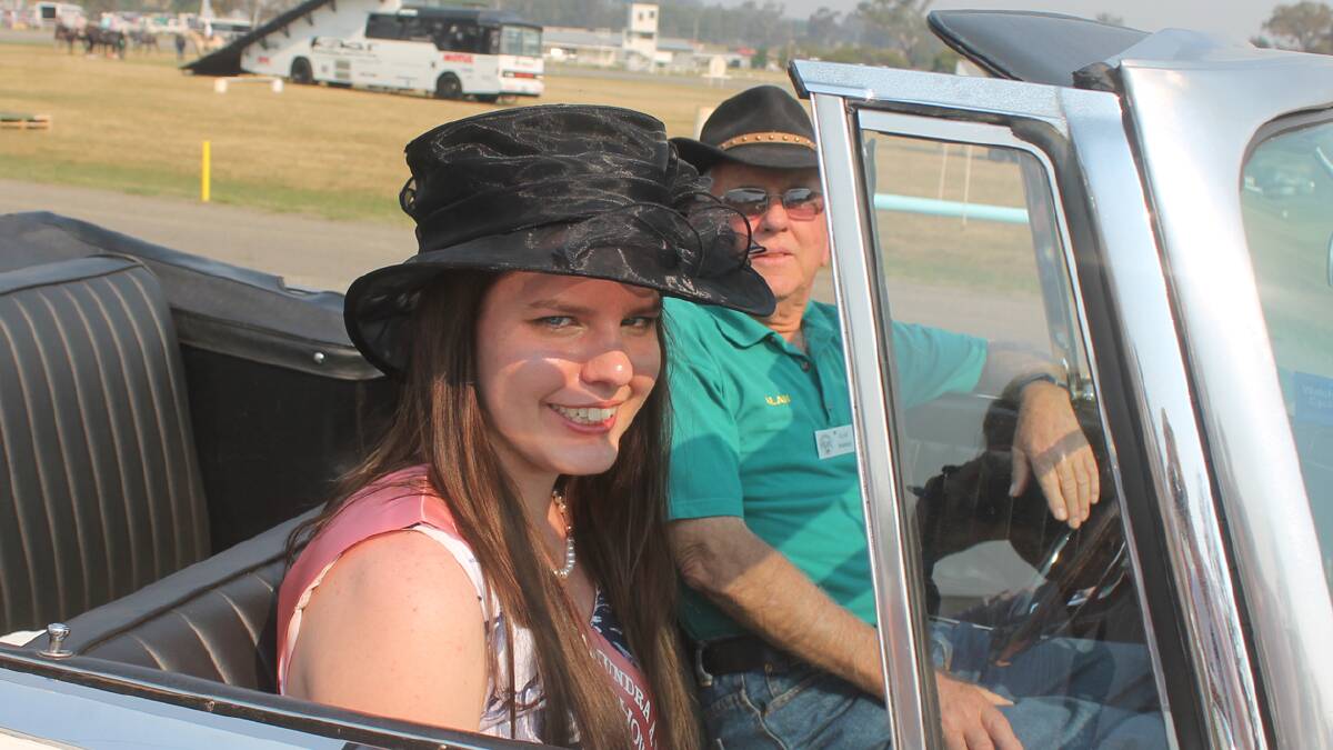 JOY RIDE: set to enjoy a lap on the showground in honour of the 2013 Coota Show Showgirl entrants are entrant Naomi Clements and vintage car driver and member of the Cootamundra Antique Motor Club Alan Thompson. 