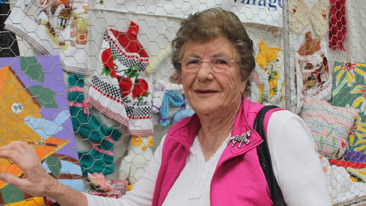 FABULOUS WORK: Rose Cowled admires the Southern Cross Care Cootamundra retirement Village display at the Coota Show on the weekend.   Photo: Melinda Chambers 