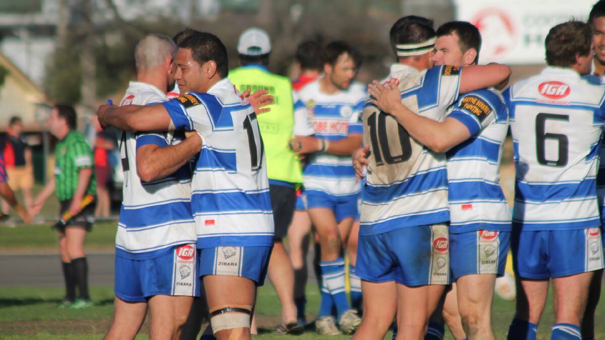  FINALS TRIUMPH: Cootamundra Bulldogs players congratualte each other after their 36-30 win over Wagga Kangaroos at Fisher Park. They will now play Gundagai in this week’s semi. Photo: Melinda Chambers