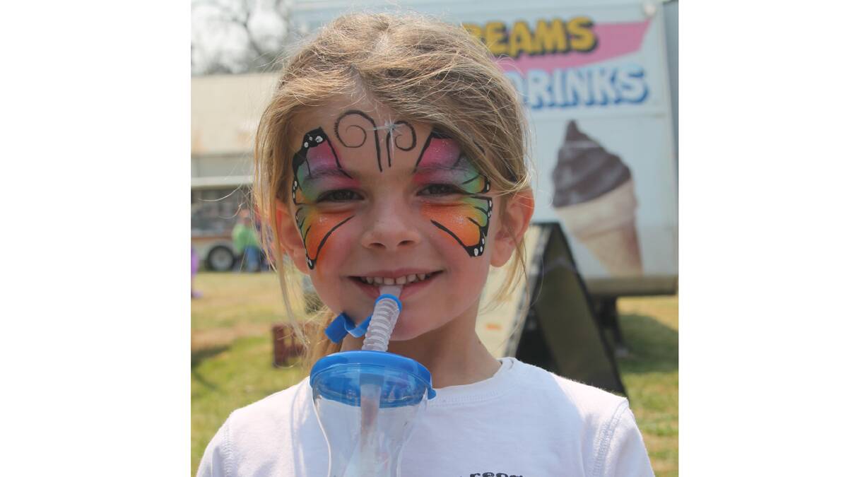  COLOURFUL: Five-year-old Eliza Tozer enjoys a slushie during the Cootamundra Show on the weekend.
