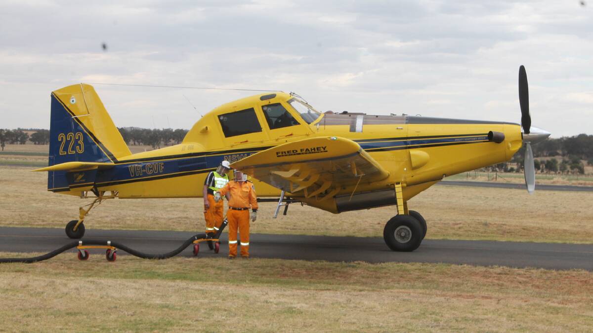  REFUELING: Pictured is one of the aircrafts used to drop water onto the fires on Wednesday.