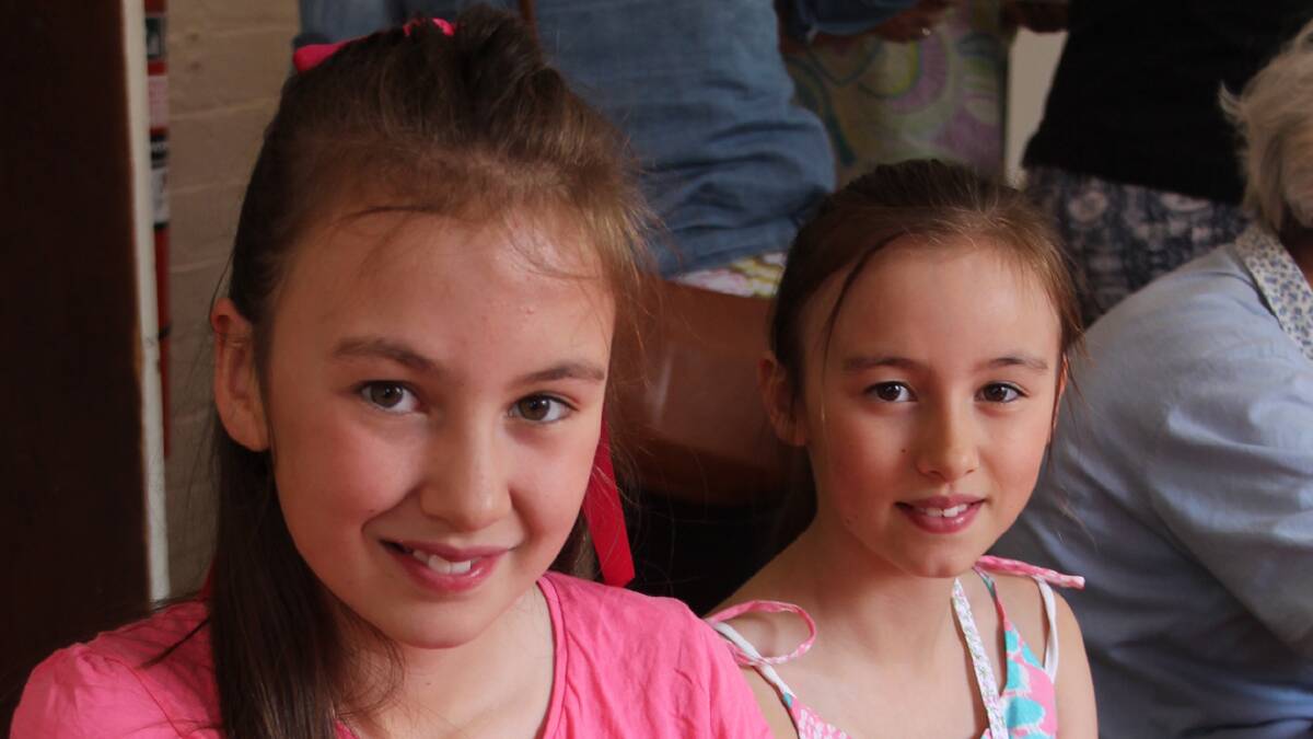  FUN: Enjoying the Wallendbeen Red Cross Christmas Fair on Saturday were sisters  Sophie and Phoebe Lyne.