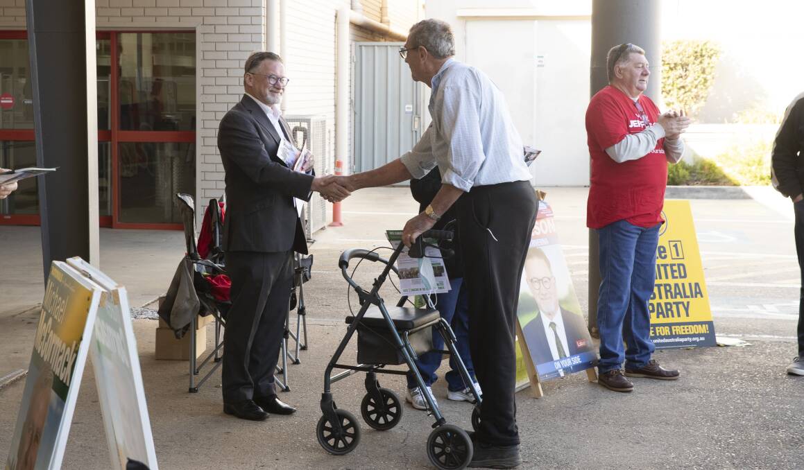Labor's Mark Jeffreson was one of many Riverina candidates and party representatives handing out 'how to vote' cards for yesterday's first official pre-polling day. Picture Madeline Begley