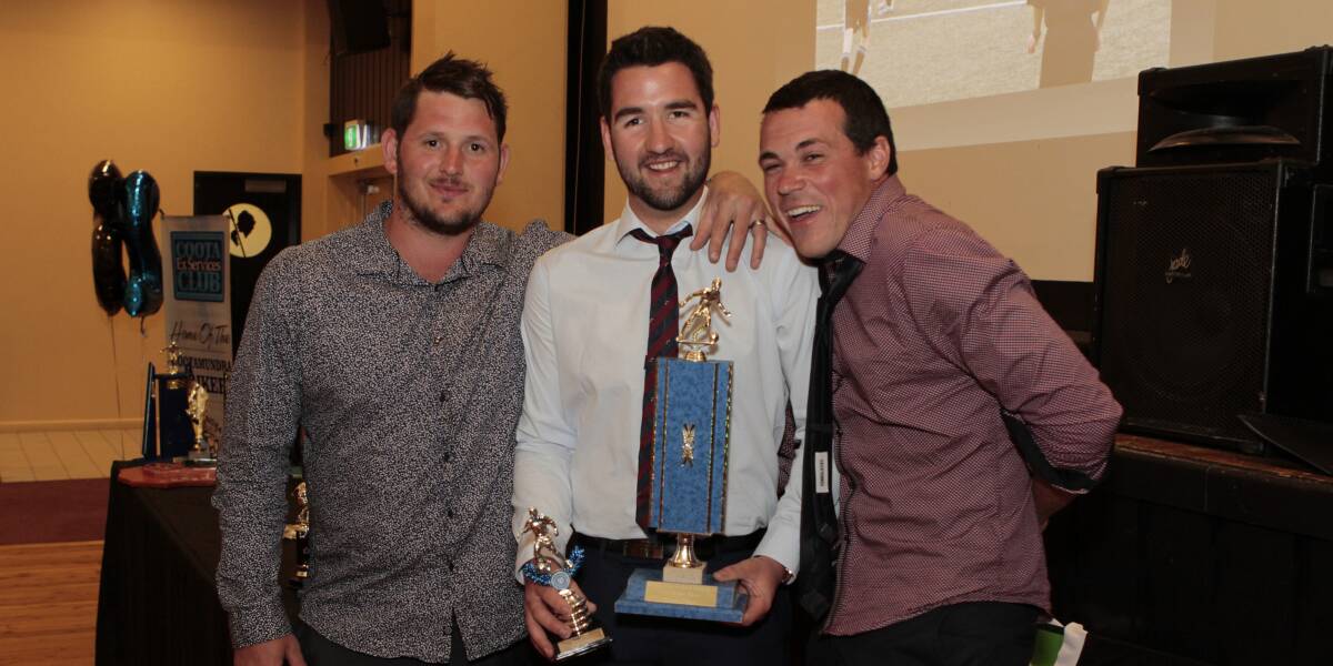 WINNER: Strikers midfielder Mark Rogers, pictured with co-coaches Brent Farnsworth and Adam McPhail, accepts the club's first grade men's Best and Fairest Award. Picture: Kelly Manwaring