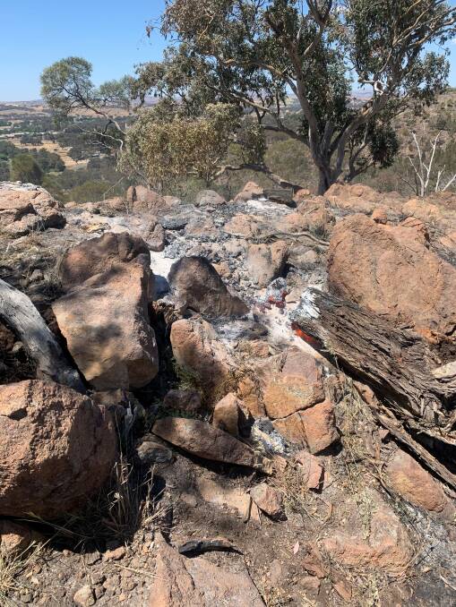 Still smouldering: The fire at Pioneer Park was inaccessable to vehicles and heavy machinery, creating headaches for NSW Rural Fire Service officers. Picture: contributed