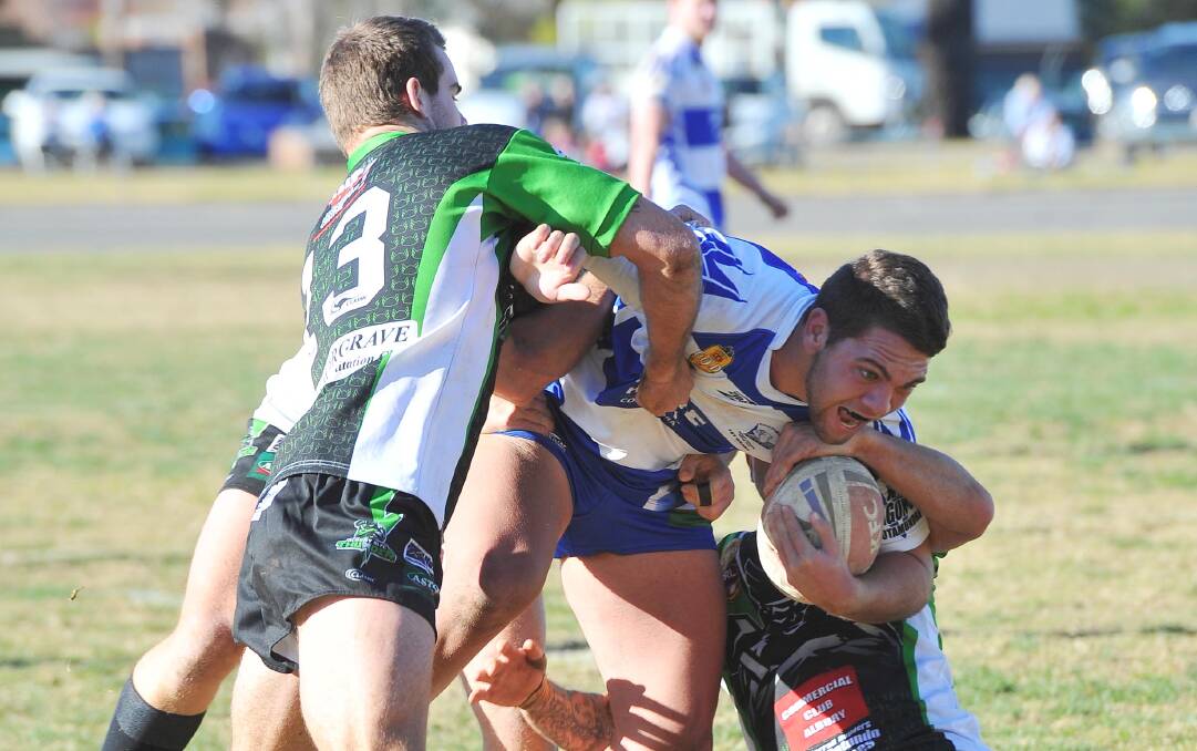 WRAPPED UP: Andre Iro is surrounded by Albury's defence during his first stint with Cootamundra in 2014. Iro and James Strickland are the latest recruits heading to the Bulldogs for the 2020 season.