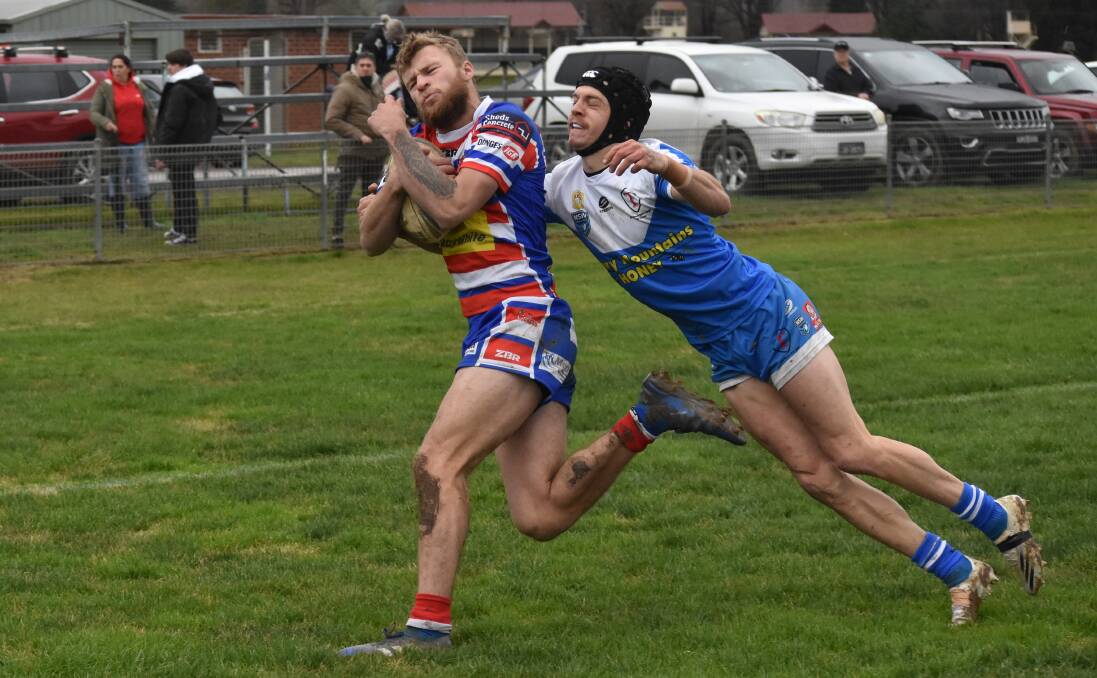 TRY TIME: MItch Ivill can't stop Nic Hall from opening the scoring in Young's tight win over Tumut on Saturday. Picture: Courtney Rees