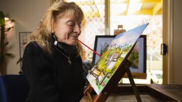 Cootamundra artist Beryl Hanlon has been painting pictures with her mouth since she was just 15. Picture by Ash Smith 