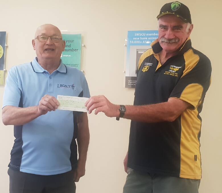 Pat Kerin presenting a cheque to Cootamundra Legacy.