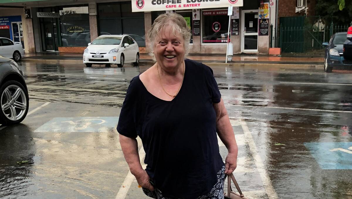 Lesley Bennett gets a drenching as she makes her way to the hairdresser.