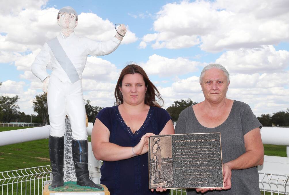 MEMORIAL: Tegan Ellis and Louise Clayton at Murrumbidgee Turf Club with the plaque they're donating to commemorate fallen jockeys. Picture: Kieren L Tilly