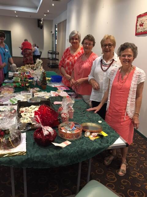 HUME HELPERS: Ariah Park members Robin Furphy, Helen Judd, Robyn Dyason and Jean Dyason look after the Christmas stall at the Hume Group meeting.