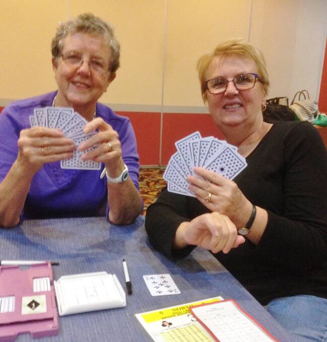 FUN: Wendy Jenkins and Ruth McCarthy enjoy themselves at the bridge table. Subs of $25 are due by the end of February. 