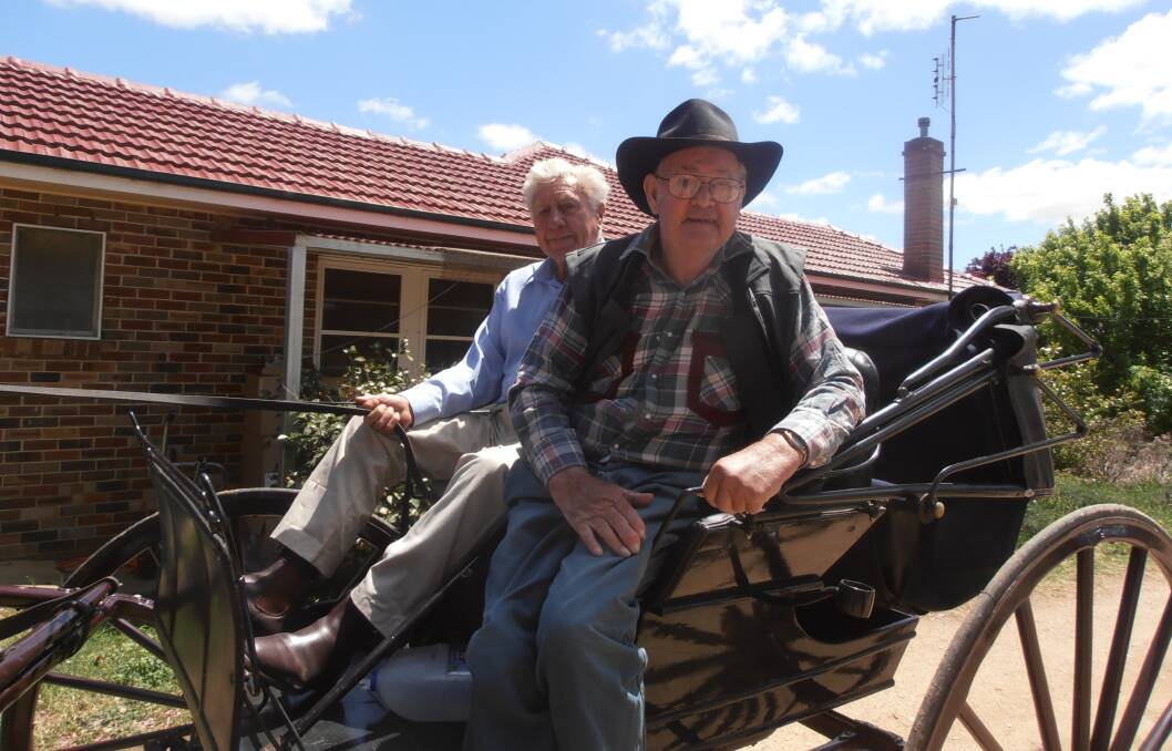 BIRTHDAY SURPRISE: Harold Packham with Keith Phillips enjoying a buggy ride around Harden for Harold's 95th birthday recently. Picture: Contributed
