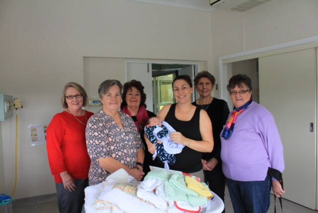 HELLO WORLD: Sue McGlynn, nurse manager, Lois James, Gloria Schultz, president CWA, mum Janine Ricketts and Tommy, with Lyn Conkey and Jeanette Puckeridge. 
