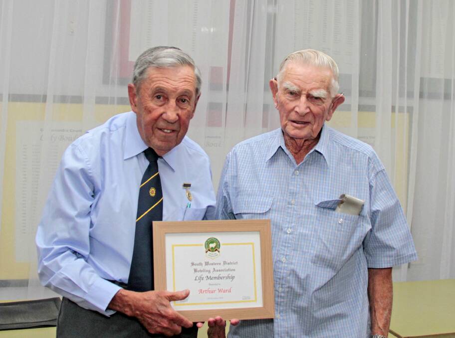 HONOUR: Arthur Ward was presented the South Western District life membership by Cliff Traynor South Western District Bowls President. Picture: Kelly Manwaring