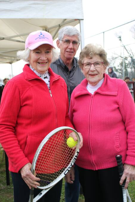 HONOUR:  Diana Buchanan and Rose Cowled, both 91,cut the ribbon at the new tennis courts, with support from Terry Cowled. Picture: John Malone