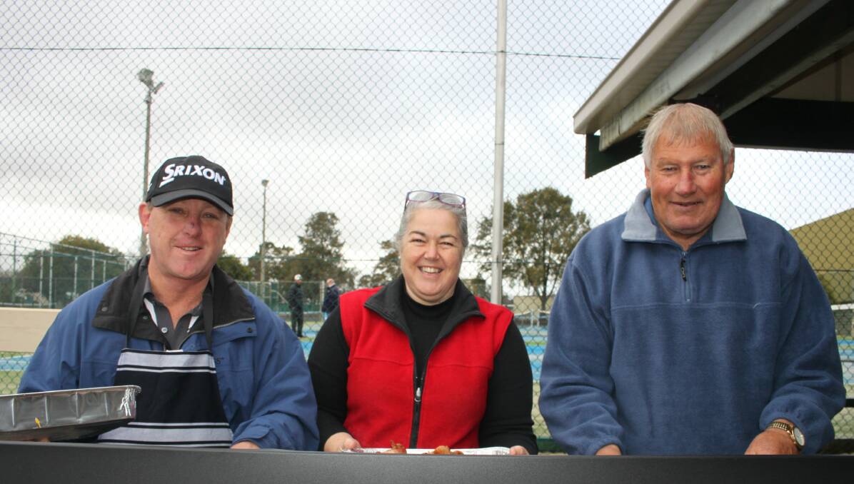 COOKS: Barbecue experts Michael Trinder, Wendy Schade and Rod Bradley - on hand at the opening of the new tennis courts. Picture: John Malone