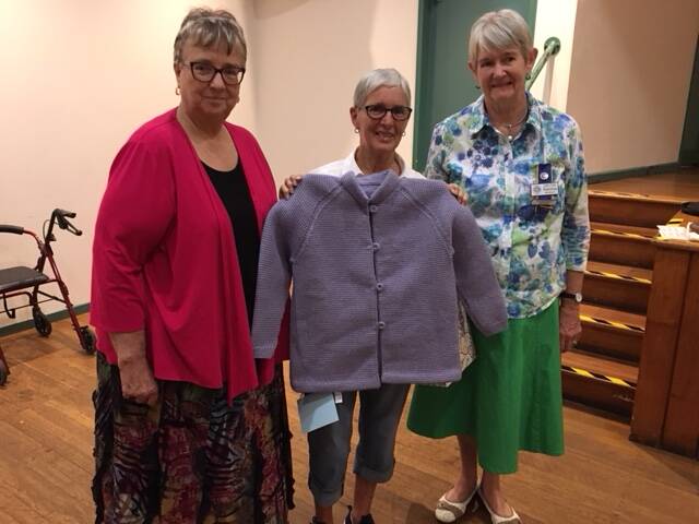 CRAFTY: Handicraft judge Elizabeth Furner with Barbara Wignall and her champion jacket and handicraft officer Patricia Herbert. Picture: Contributed