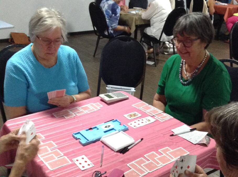 BRIDGE: Di Scott and Jude Hillam deep in concentration during a recent game of bridge. Picture: Contributed